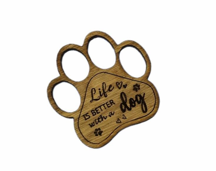 Mini thread holder and needle minder, engraved with the message 'Life is better with a dog'. A practical and heartwarming accessory for any sewing or crafting enthusiast, this dual-purpose item keeps your threads organised and your needles safe.