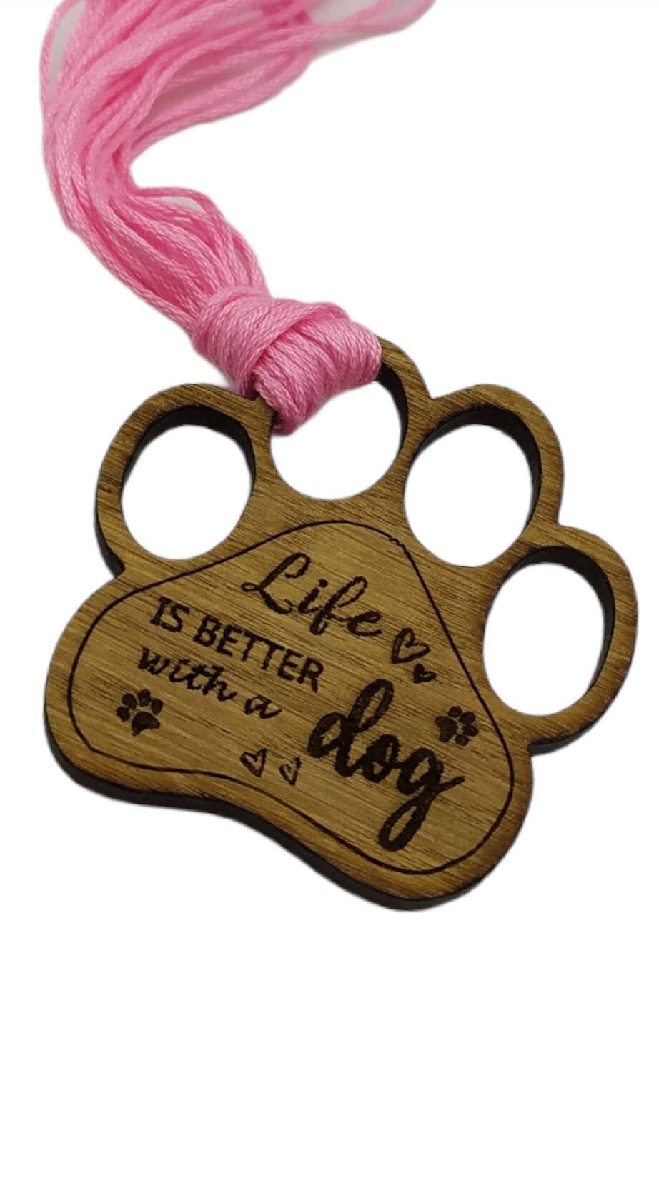 Mini thread holder and needle minder, engraved with the message 'Life is better with a dog'. A practical and heartwarming accessory for any sewing or crafting enthusiast, this dual-purpose item keeps your threads organised and your needles safe.