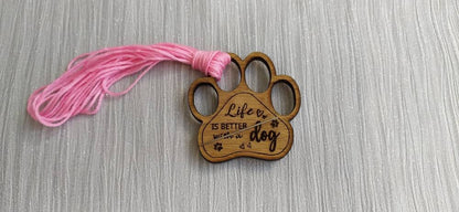 Mini thread holder and needle minder, engraved with the message 'Life is better with a dog'. A practical and heartwarming accessory for any sewing or crafting enthusiast, this dual-purpose item keeps your threads organised and your needles safe.