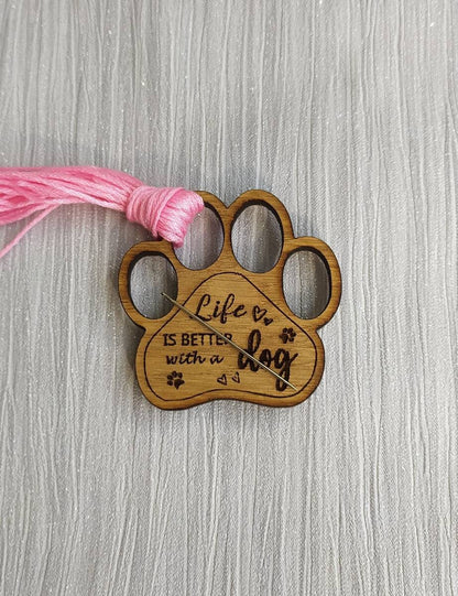 Mini thread holder and needle minder, engraved with the message 'Life is better with a dog'. A practical and heartwarming accessory for any sewing or crafting enthusiast, this dual-purpose item keeps your threads organised and your needles safe.