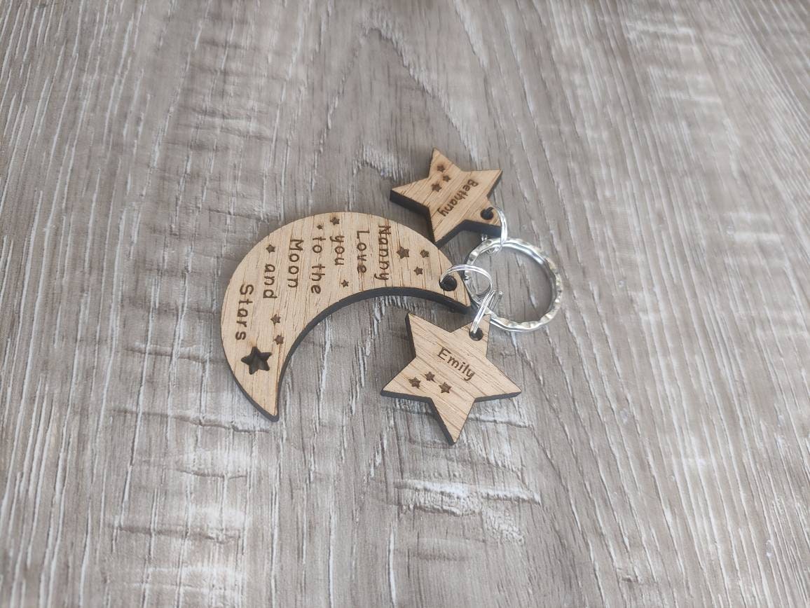 Moon-shaped keyring engraved with "Love you to the Moon & Stars" and star charms engraved with a child's name.
