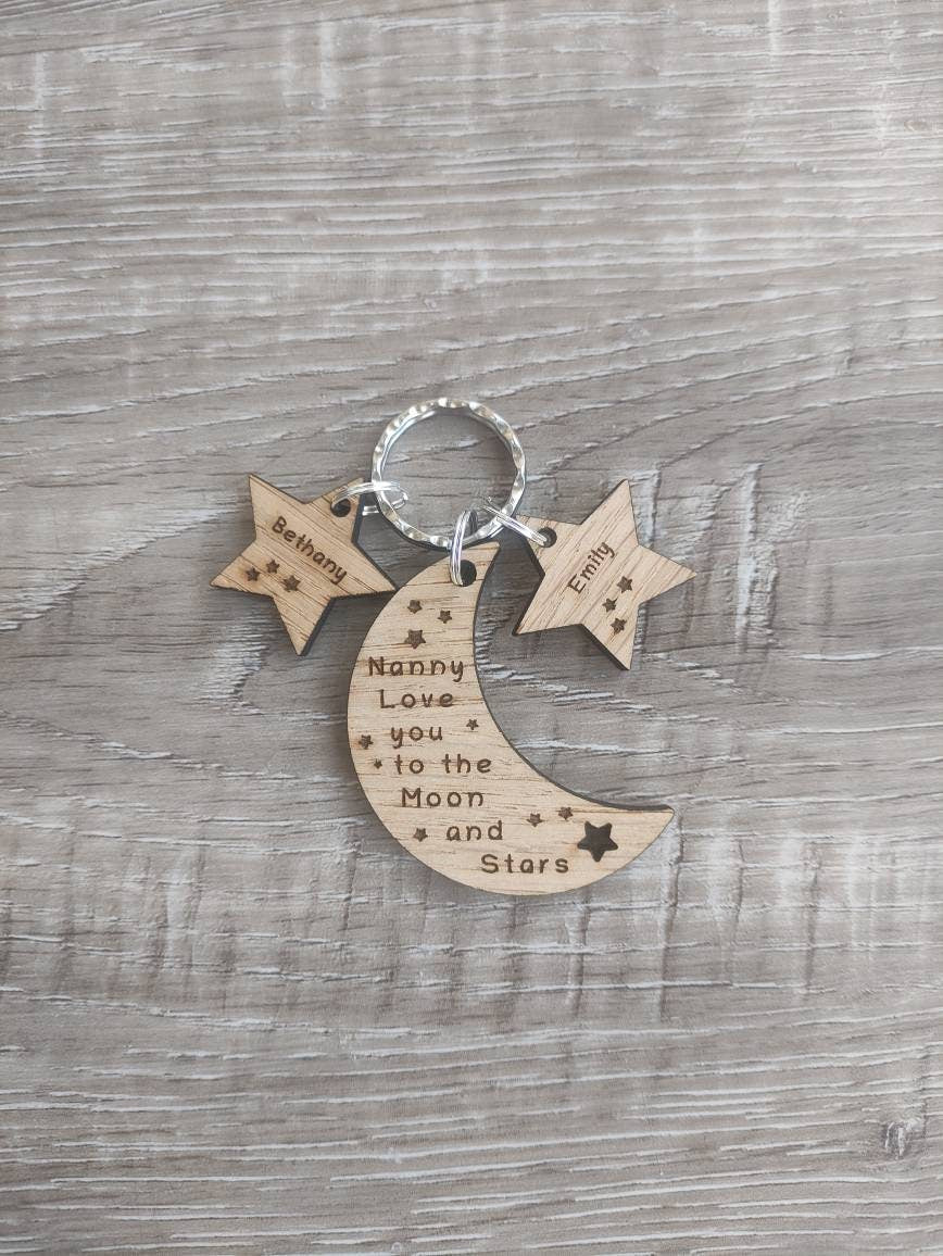 Moon-shaped keyring engraved with "Love you to the Moon & Stars" and star charms engraved with a child's name.