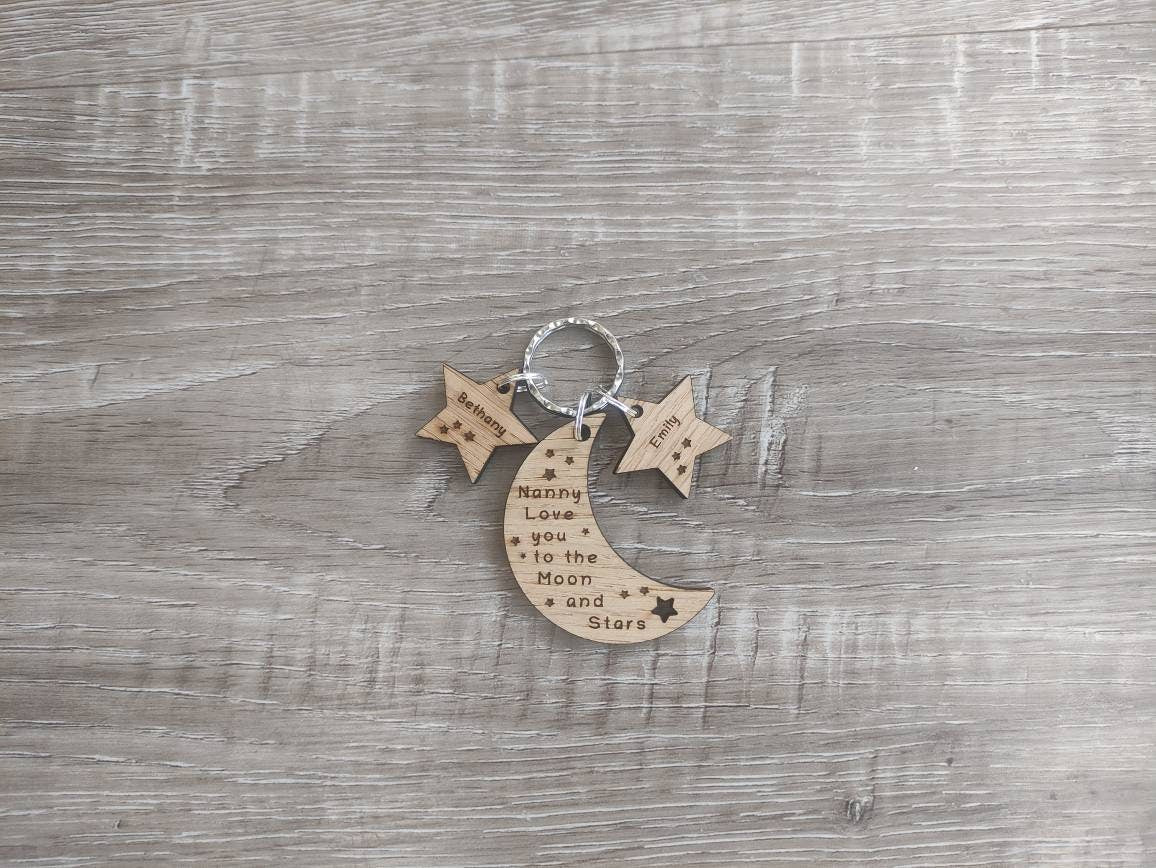 Moon-shaped keyring engraved with "Love you to the Moon & Stars" and star charms engraved with a child's name.
