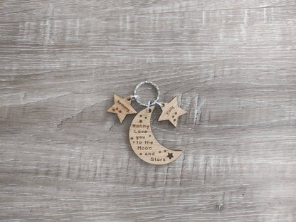 Moon-shaped keyring engraved with "Love you to the Moon & Stars" and star charms engraved with a child's name.