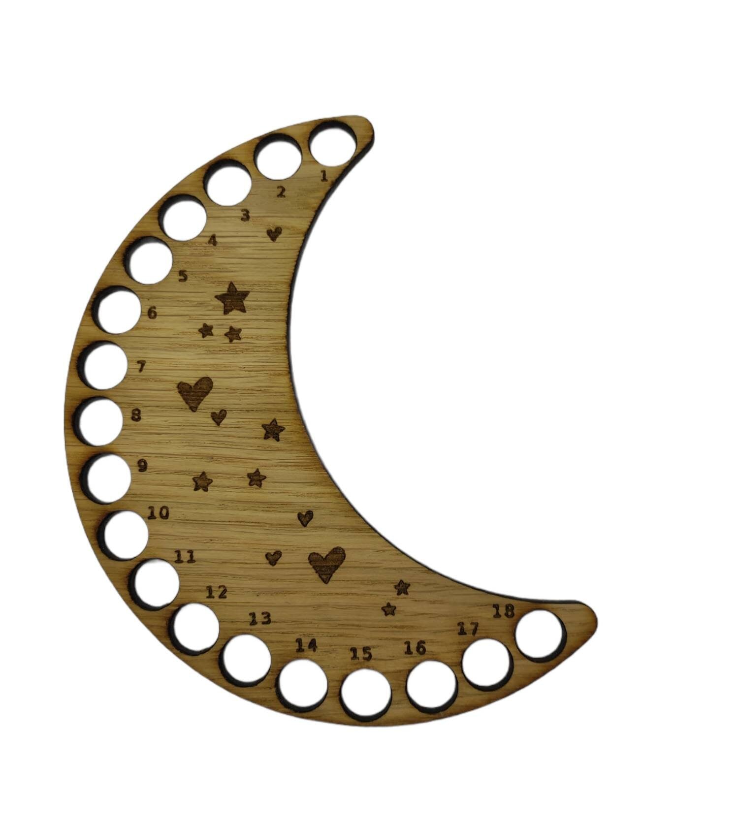 Moon shaped thread holder with stars and hearts engraved, featuring holes for 18 threads.