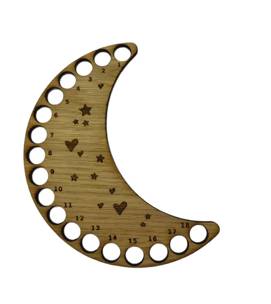 Moon shaped thread holder with stars and hearts engraved, featuring holes for 18 threads.