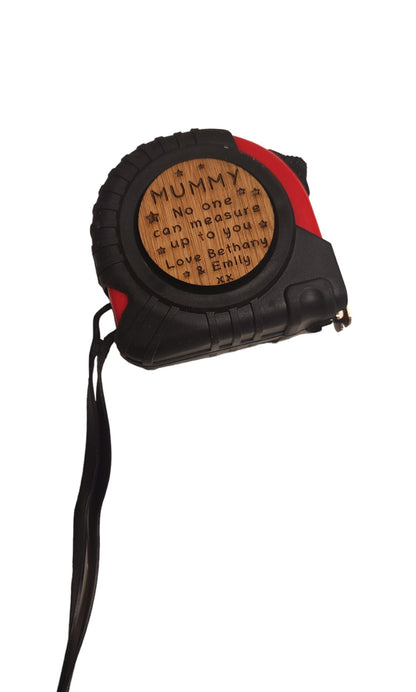 Personalised tape measure with a wooden disc, custom engraved names with your chosen message. This unique, functional gift combines practicality with a fun, stylish touch.