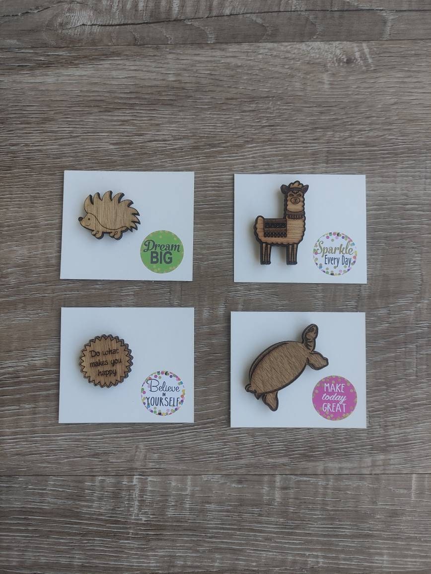 Round soft jagged edges needle minder with "Do What Makes You Happy" engraved: