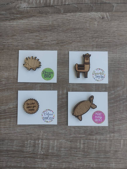 Round soft jagged edges needle minder with "Do What Makes You Happy" engraved: