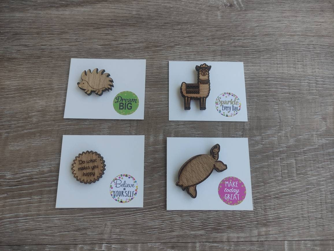 Round soft jagged edges needle minder with "Do What Makes You Happy" engraved: