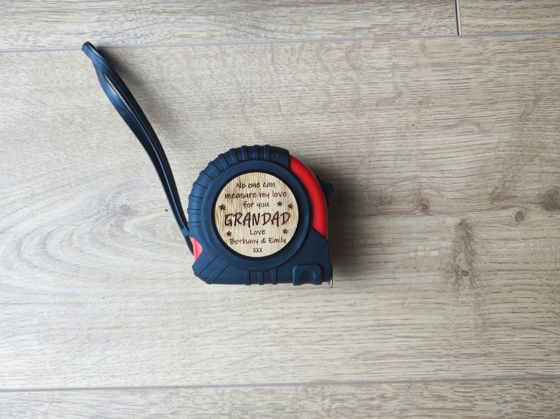 Round tape measure with a playful message: 'No one can measure my love for you.' The disc features a compact, convenient design with a retractable tape, perfect for a thoughtful and unique gift.