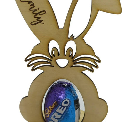 Personalised Bunny Easter Egg Holder, laser engraved with a name on the ear and a message on the base, designed to hold a chocolate egg