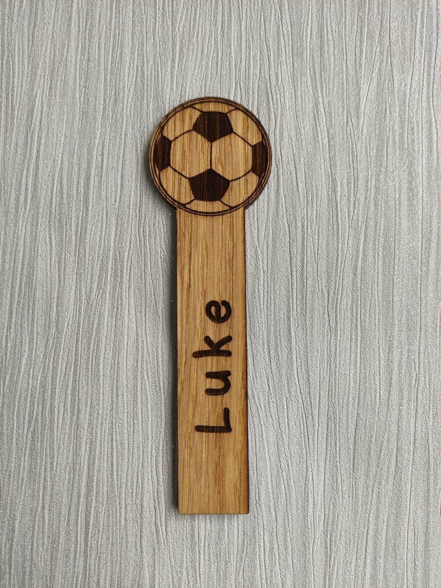 Wooden football bookmark engraved with any name, featuring the football as part of the design at the top.