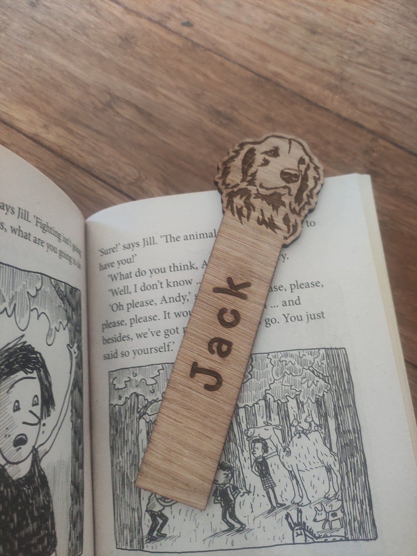 Personalised oak veneer dog bookmark with a dog design at the top and a custom name engraved vertically down the middle. Perfect for children's gifts, stocking stuffers, and party bag fillers.