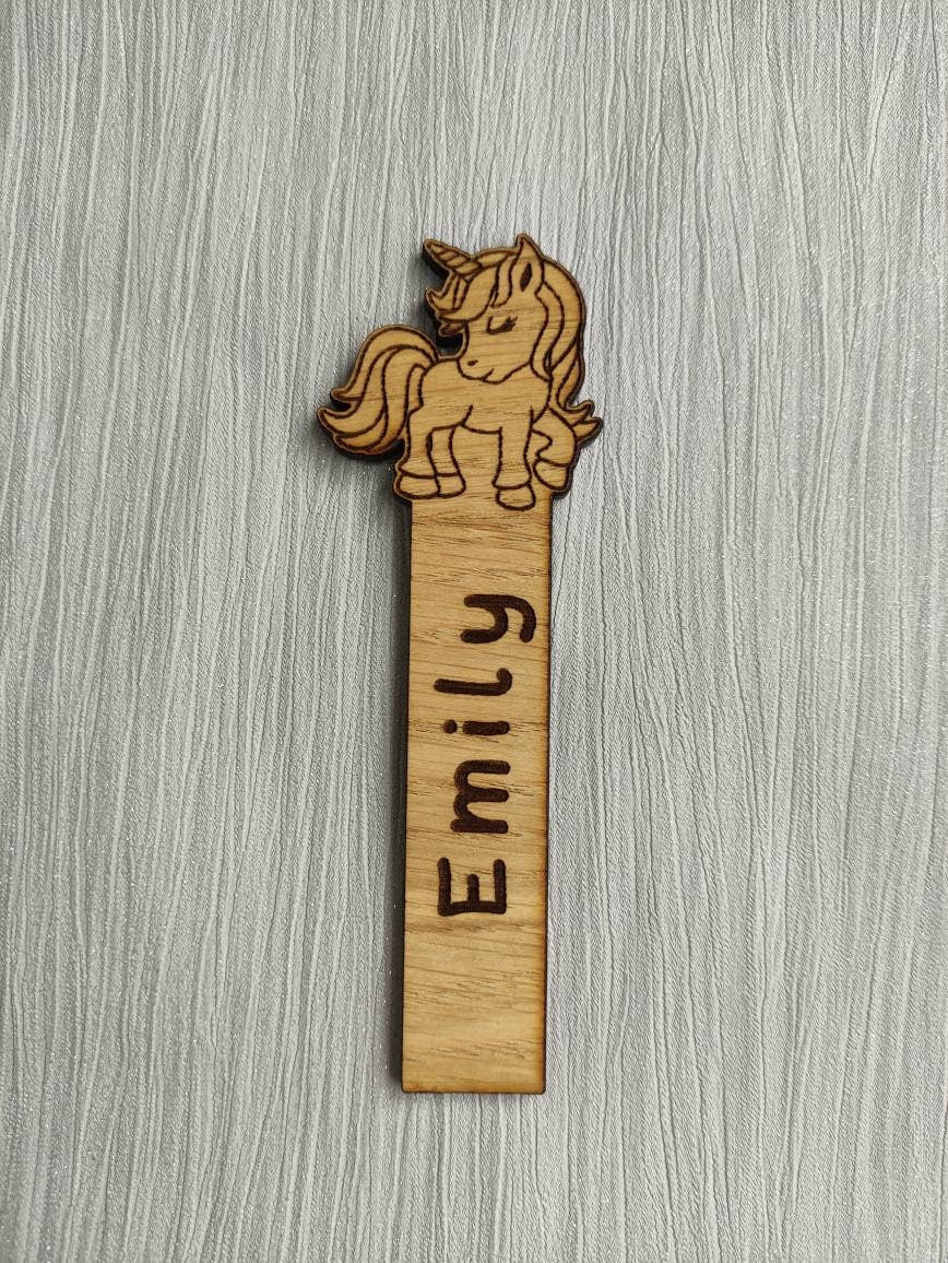 Wooden Unicorn bookmark engraved with any name, featuring the Unicorn as part of the design at the top.