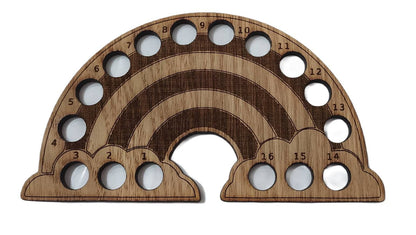 Rainbow-shaped thread holder with 16 holes for organising thread.