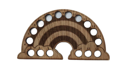Rainbow-shaped thread holder with 16 holes for organising thread.