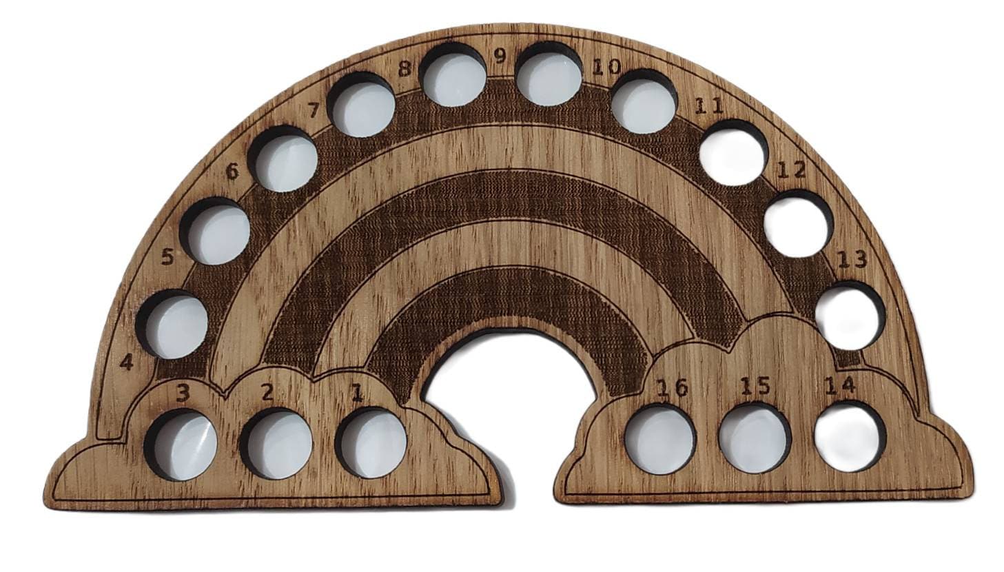 Rainbow-shaped thread holder with 16 holes for organising thread.