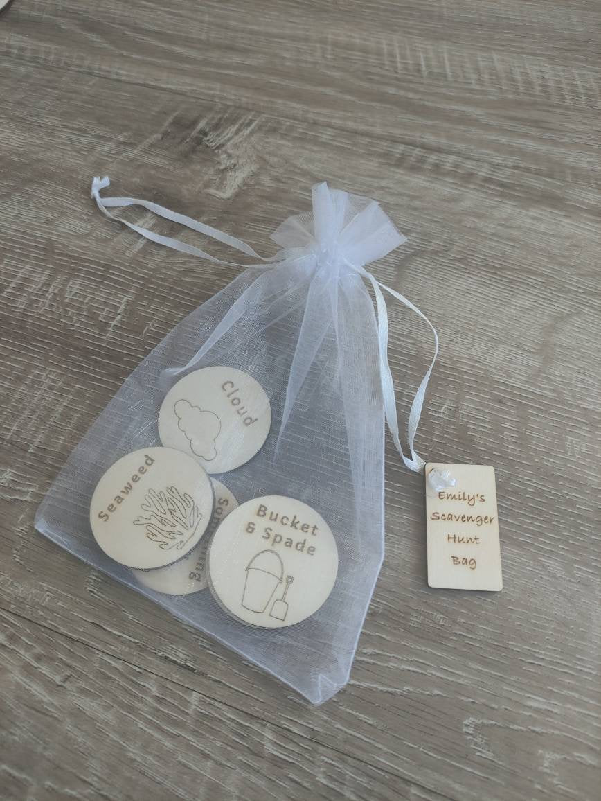 Wooden discs with engraved scavenger hunt prompts, featuring different things to find.