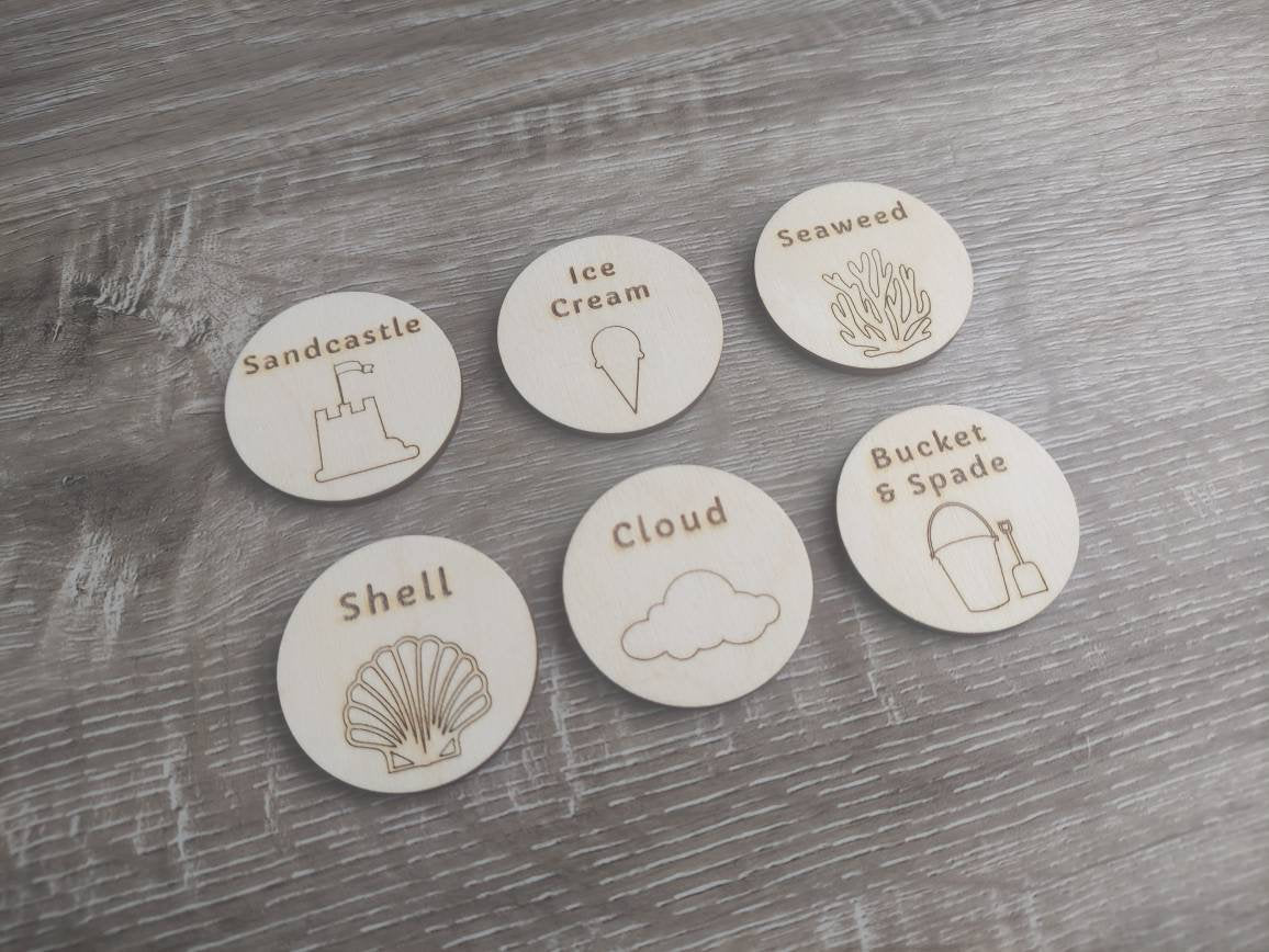 Wooden discs with engraved scavenger hunt prompts, featuring different things to find.