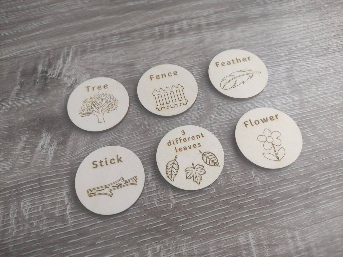 Wooden discs with engraved scavenger hunt prompts, featuring different things to find.