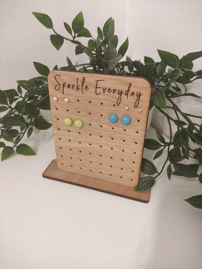 Laser-engraved oak veneer earring holder with the message "Sparkle Everyday," designed to hold up to 32 pairs of stud earrings.