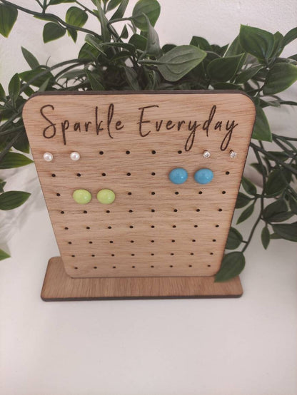 Laser-engraved oak veneer earring holder with the message "Sparkle Everyday," designed to hold up to 32 pairs of stud earrings.