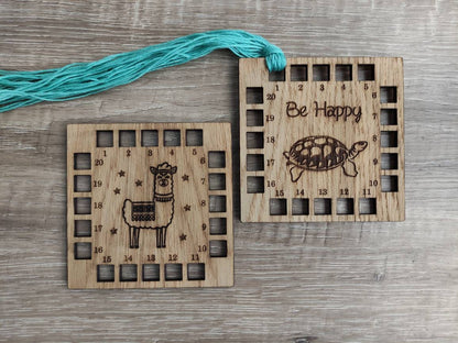 Square shape thread holder, with Llama and stars engraved in the middle. 20 holes for thread.