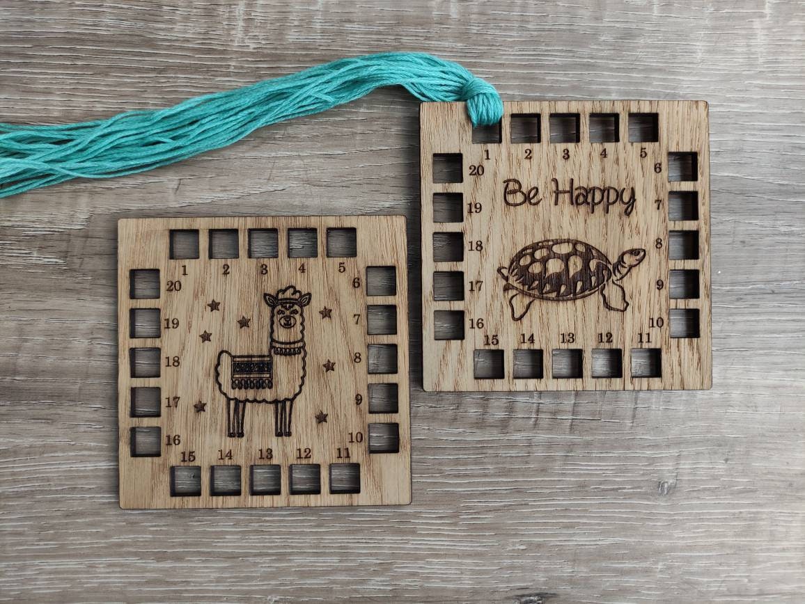 Square shape thread holder, with Llama and stars engraved in the middle. 20 holes for thread.