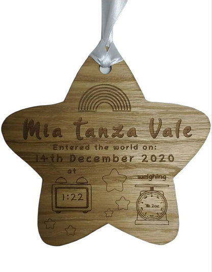 Personalised oak veneer wooden star engraved with a newborn's full name, date of birth, time, and weight. Finished with a white string for hanging, making it a thoughtful keepsake for families.