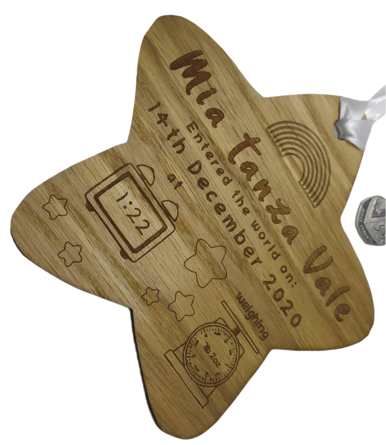 Personalised oak veneer wooden star engraved with a newborn's full name, date of birth, time, and weight. Finished with a white string for hanging, making it a thoughtful keepsake for families.