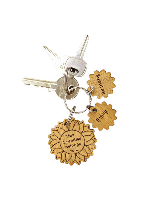 Sunflower-style keyring engraved with "This (any name) belongs to..." and customisable with additional charms.