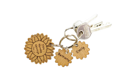 Sunflower-style keyring engraved with "This (any name) belongs to..." and customisable with additional charms.