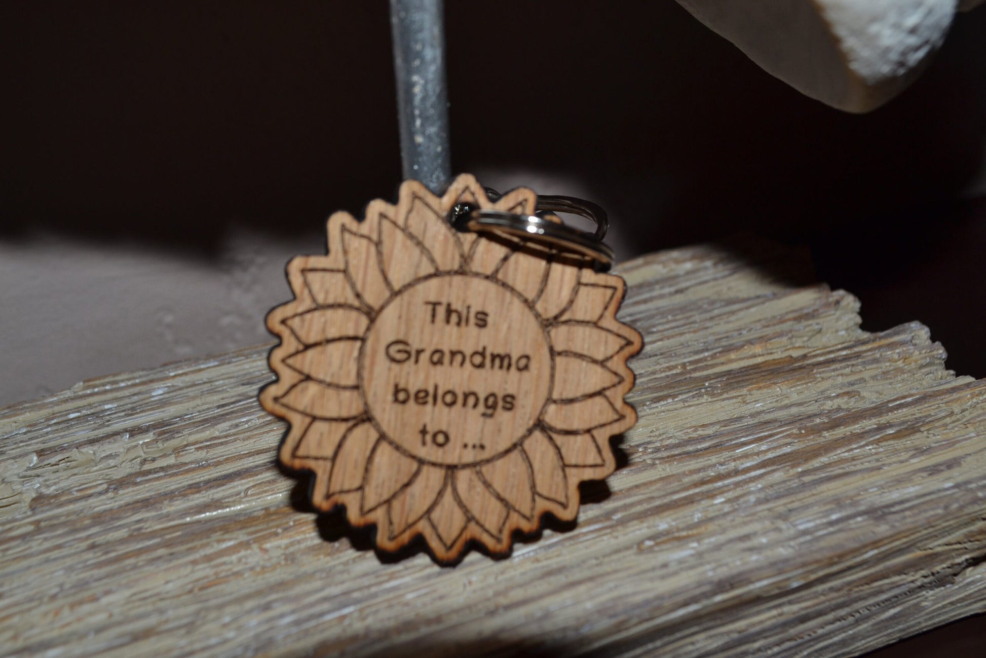 Sunflower-style keyring engraved with "This (any name) belongs to..." and customisable with additional charms.