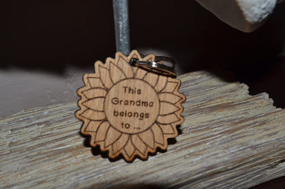 Sunflower-style keyring engraved with "This (any name) belongs to..." and customisable with additional charms.