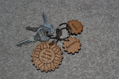 Sunflower-style keyring engraved with "This (any name) belongs to..." and customisable with additional charms.