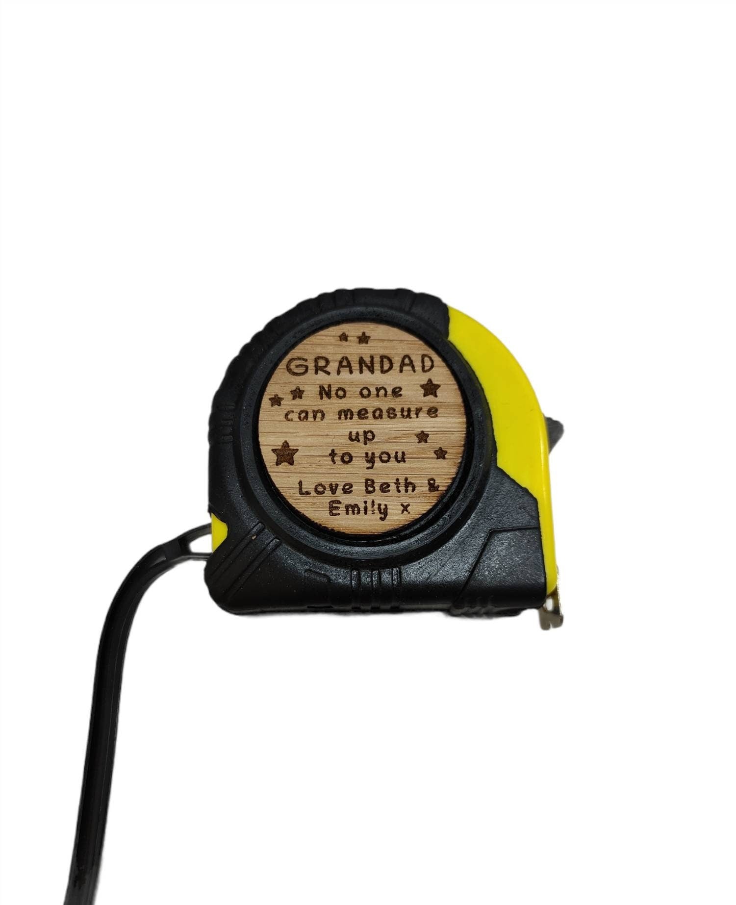 Personalised tape measure with a wooden disc, custom engraved names with your chosen message. This unique, functional gift combines practicality with a fun, stylish touch.