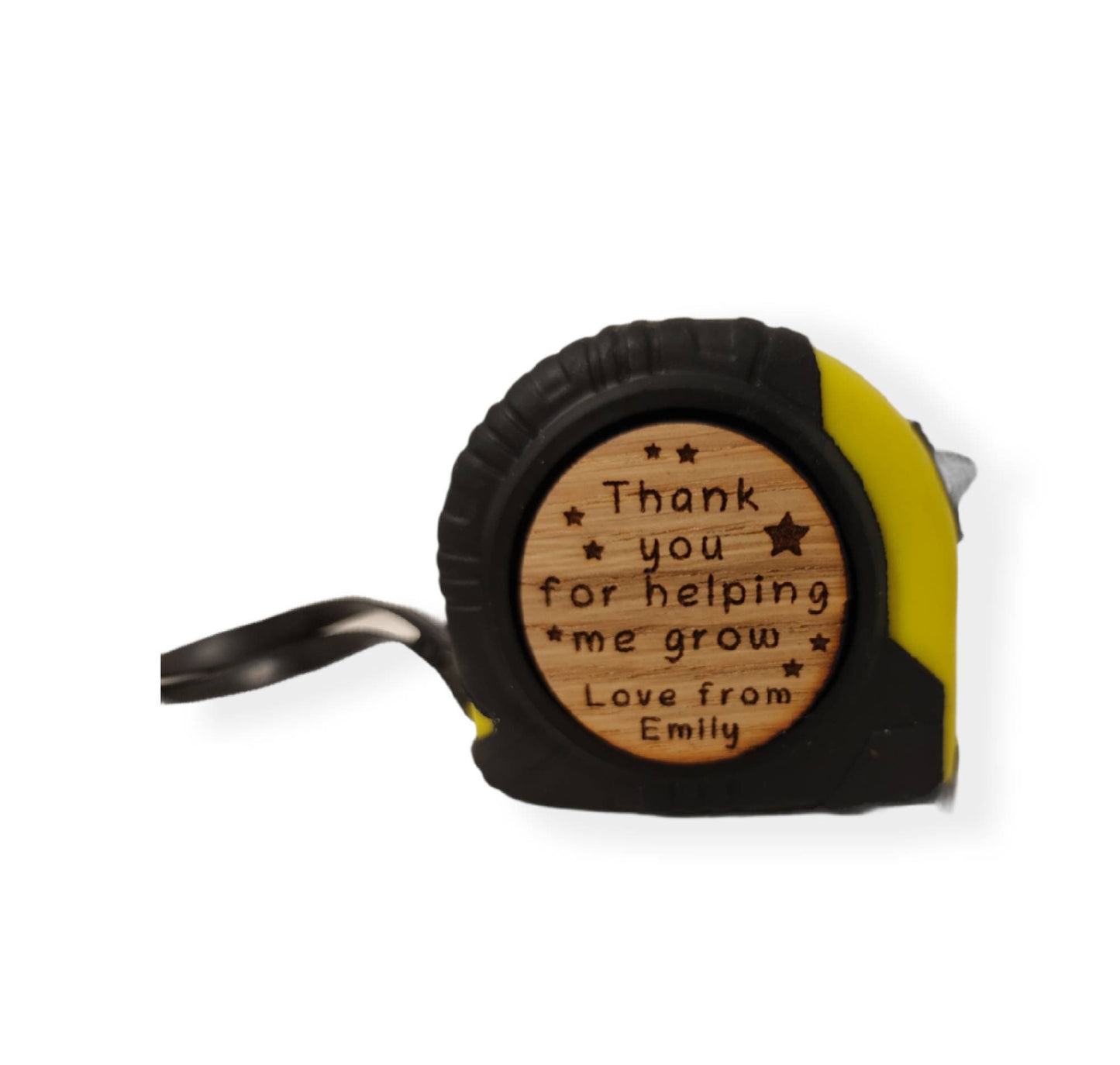 Personalised tape measure with a wooden disc, custom engraved names with your chosen message. This unique, functional gift combines practicality with a fun, stylish touch.