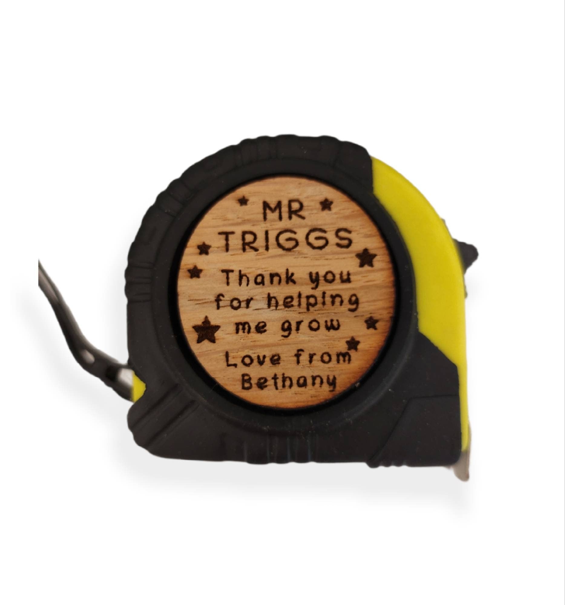 Personalised tape measure with a wooden disc, custom engraved names with your chosen message. This unique, functional gift combines practicality with a fun, stylish touch.