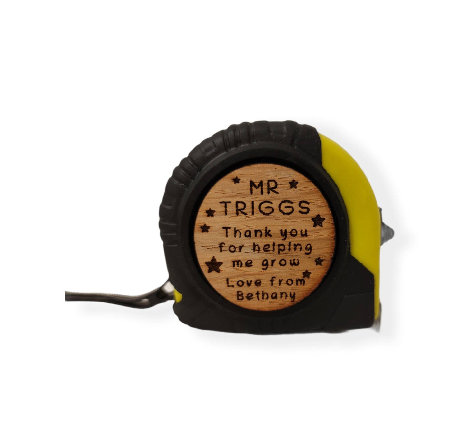 Personalised tape measure with a wooden disc, custom engraved names with your chosen message. This unique, functional gift combines practicality with a fun, stylish touch.