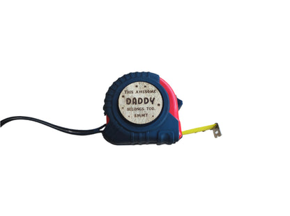 Personalised tape measure with a wooden disc engraved with This Awesome DADDY belongs too...