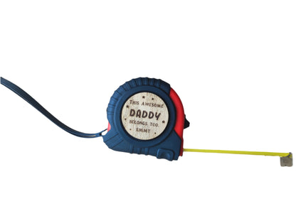 Personalised tape measure with a wooden disc engraved with This Awesome DADDY belongs too...