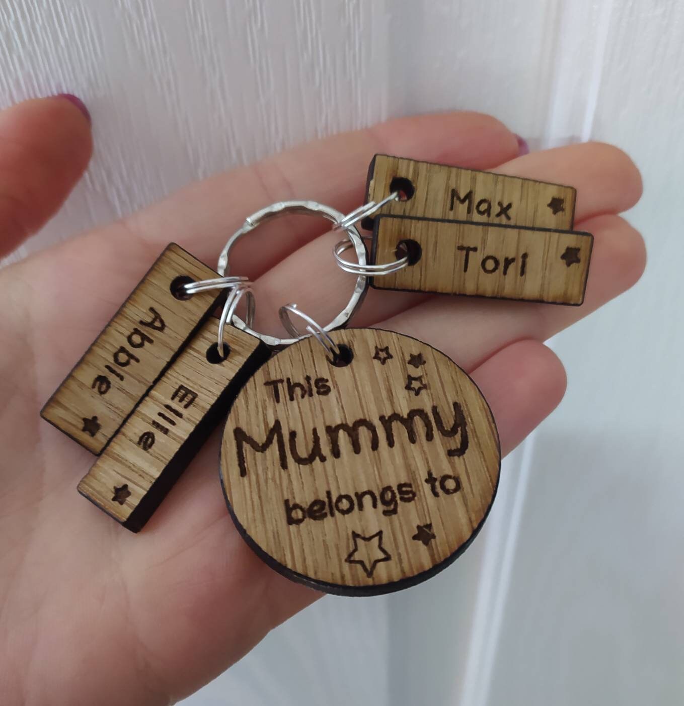 This Mummy belongs to circle keyring with engraved rectangle name charms attached.