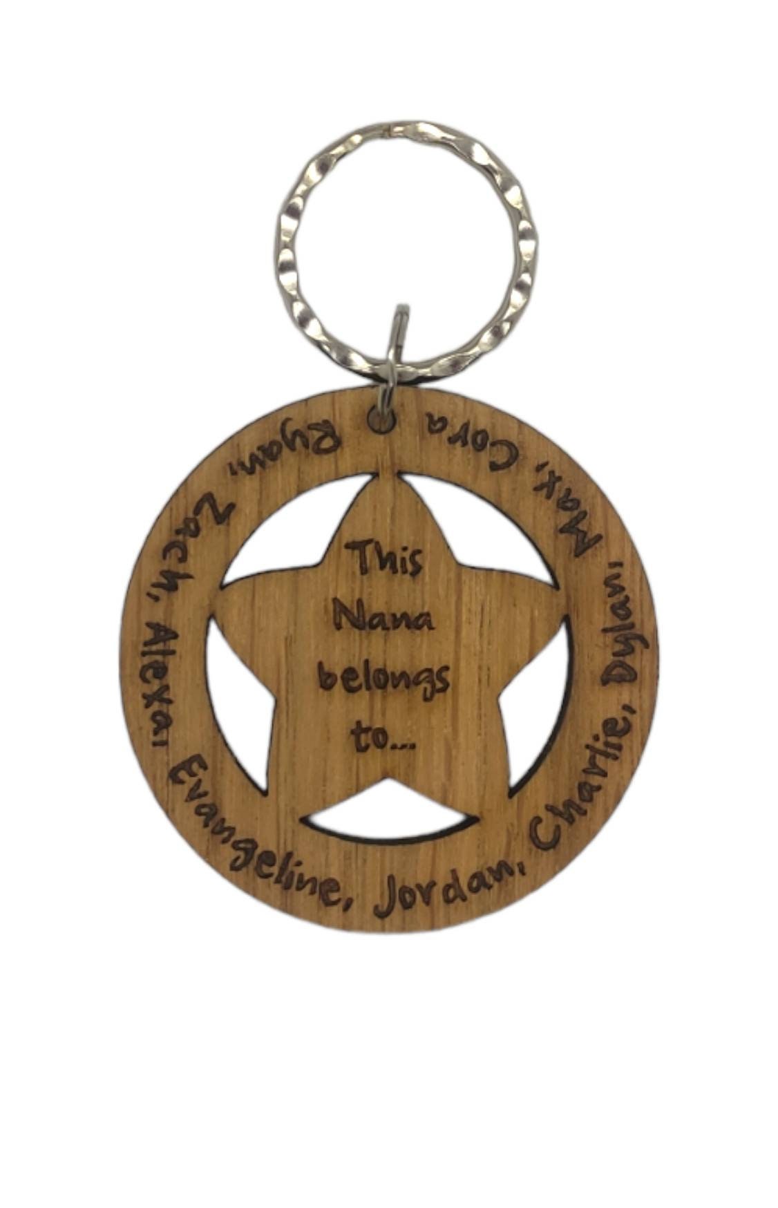 Circle keyring with family names engraved around the outside and a cut-out star in the middle, engraved with "This Nanny Belongs To..."