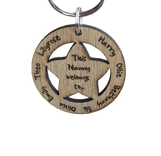 Circle keyring with family names engraved around the outside and a cut-out star in the middle, engraved with "This Nanny Belongs To..."