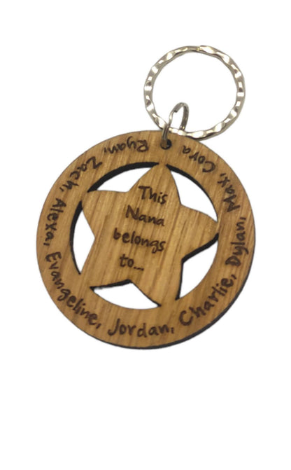 Circle keyring with family names engraved around the outside and a cut-out star in the middle, engraved with "This Nanny Belongs To..."