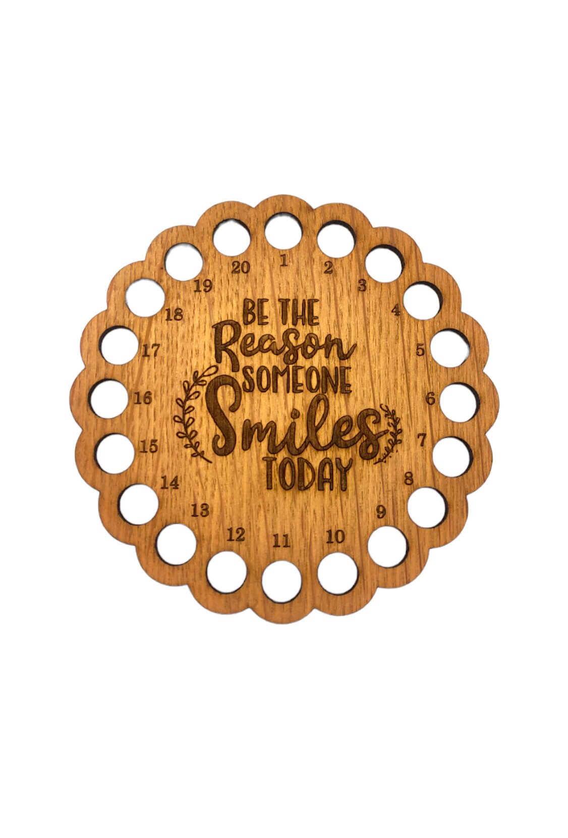 Thread holder with the words 'Be the reason someone smiles today' engraved in the middle, featuring 20 holes for organising embroidery threads.