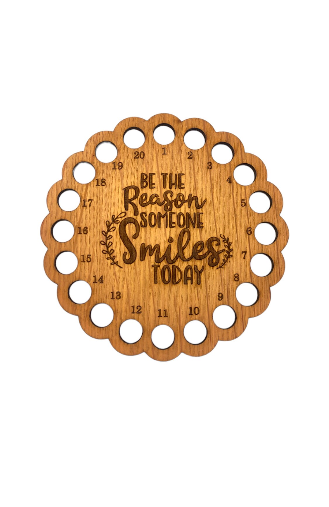 Thread holder with the words 'Be the reason someone smiles today' engraved in the middle, featuring 20 holes for organising embroidery threads.
