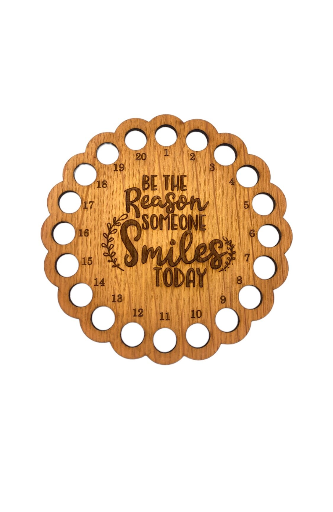 Thread holder with the words 'Be the reason someone smiles today' engraved in the middle, featuring 20 holes for organising embroidery threads.