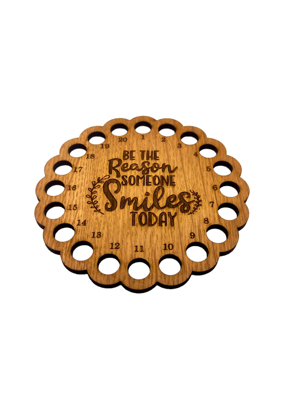 Thread holder with the words 'Be the reason someone smiles today' engraved in the middle, featuring 20 holes for organising embroidery threads.